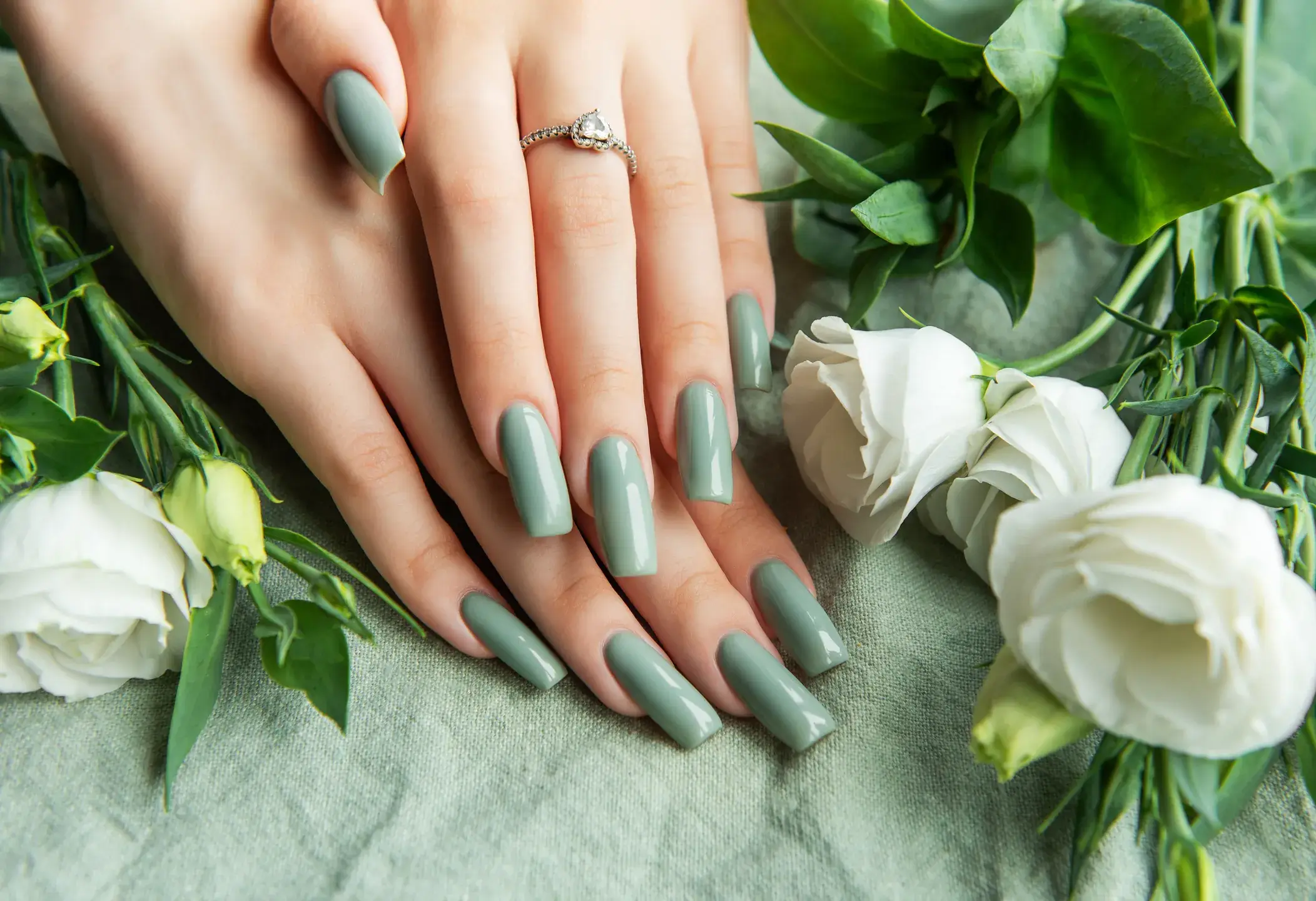Elegant hands adorned with green nail polish surro 2026 03 17 14 37 05 utc